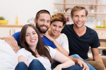 Men and women smiling after getting composite bonding, Lindenhurst NY