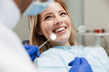 Woman in dentist chair receiving general dentistry care, Lindenhurst NY
