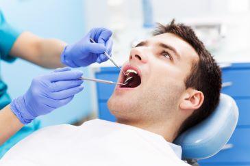 Man receiving periodontal treatment, Lindenhurst NY