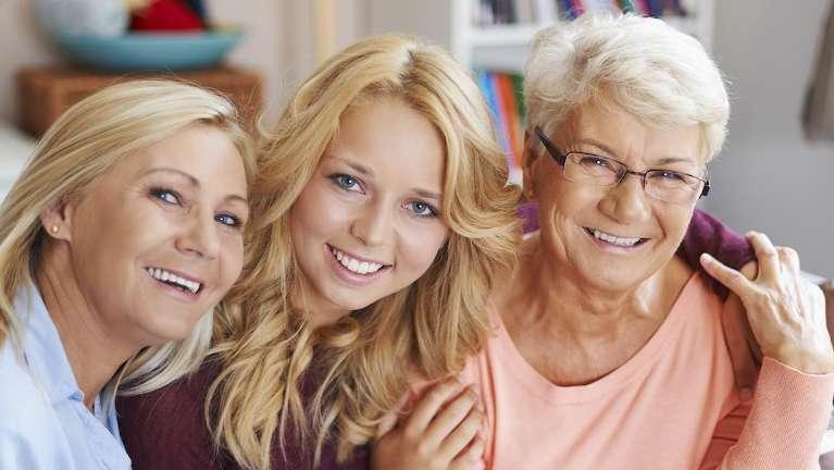 Three generations of women smiling together, lindenhurst ny