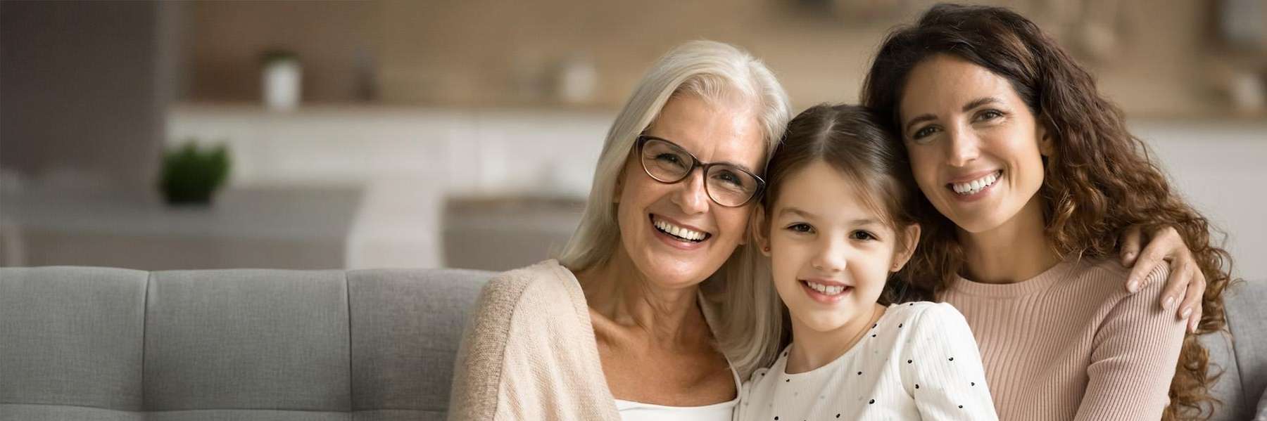 Three generations of women smiling together, lindenhurst ny