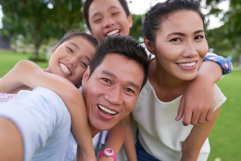 Asian family smiling together, lindenhurst ny