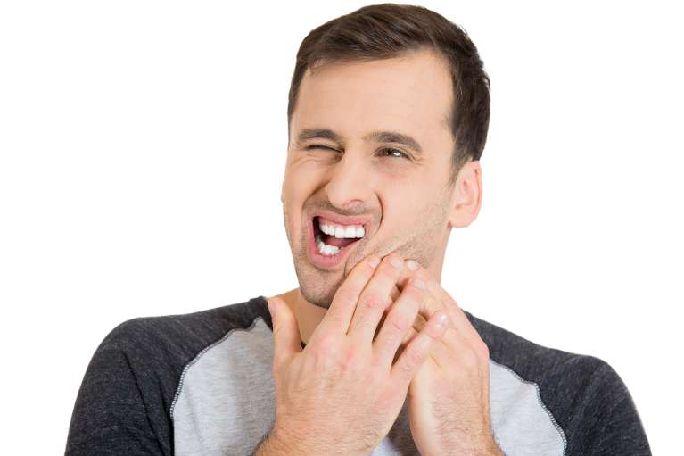Man holding mouth in pain, lindenhurst ny