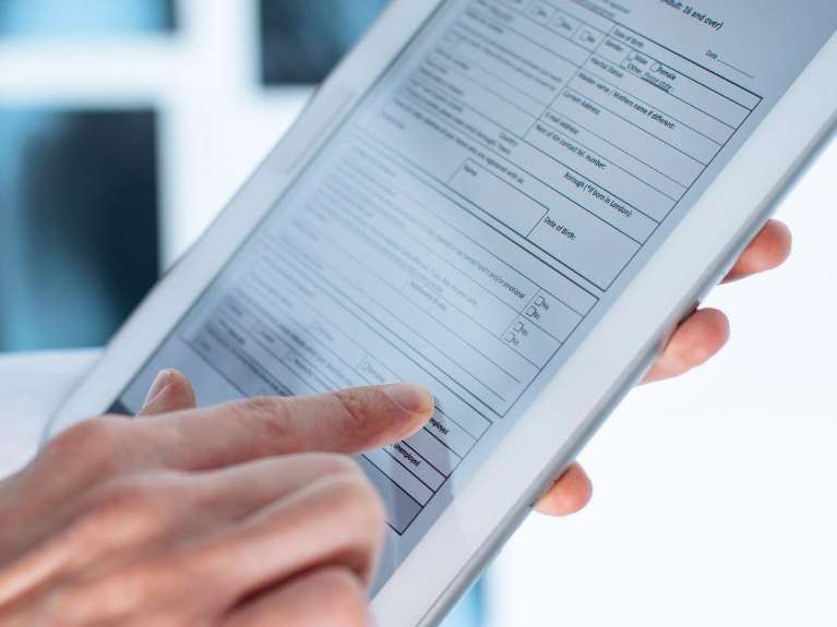 A tablet displaying digital records of a patient, Lindenhurst NY
